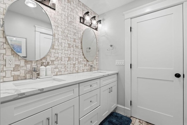 31 Henderson St Unit 1, Arlington, MA 02474 - bathroom with double vanity and decorative backsplash