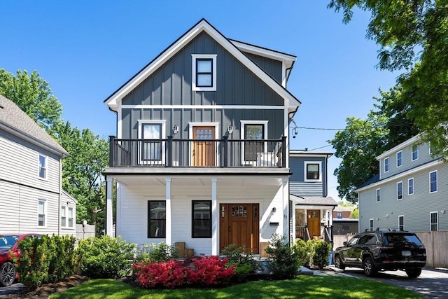 31 Henderson St Unit 1, Arlington, MA 02474 - view of front of home with board and batten siding, a balcony, and a porch
