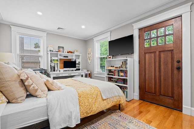 31 Henderson St Unit 1, Arlington, MA 02474 - bedroom featuring wood finished floors, ornamental molding, and recessed lighting