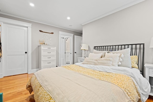 31 Henderson St Unit 1, Arlington, MA 02474 - bedroom with light wood finished floors, ornamental molding, recessed lighting, and baseboards