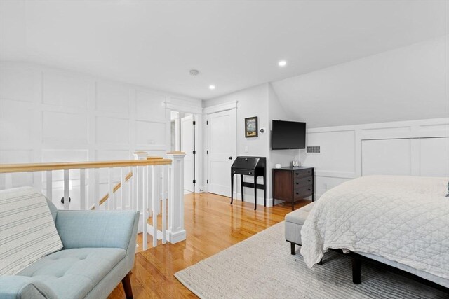 31 Henderson St Unit 1, Arlington, MA 02474 - bedroom with a decorative wall, light wood-type flooring, and recessed lighting
