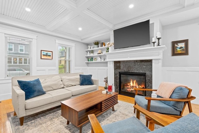 31 Henderson St Unit 1, Arlington, MA 02474 - living area featuring recessed lighting, light wood-type flooring, wainscoting, a fireplace, and a decorative wall