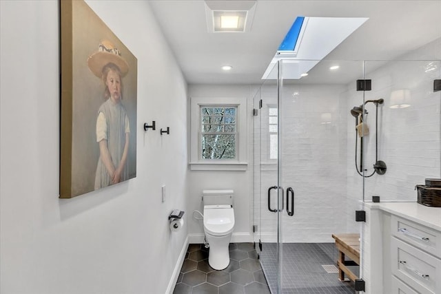 bathroom with baseboards, toilet, tile patterned floors, a shower stall, and recessed lighting