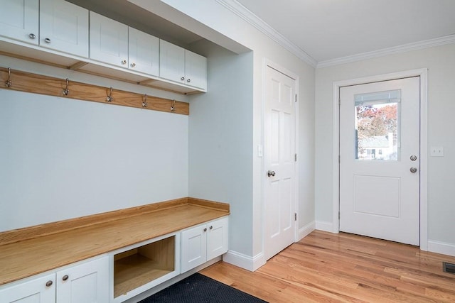 mudroom with crown molding and light hardwood / wood-style flooring