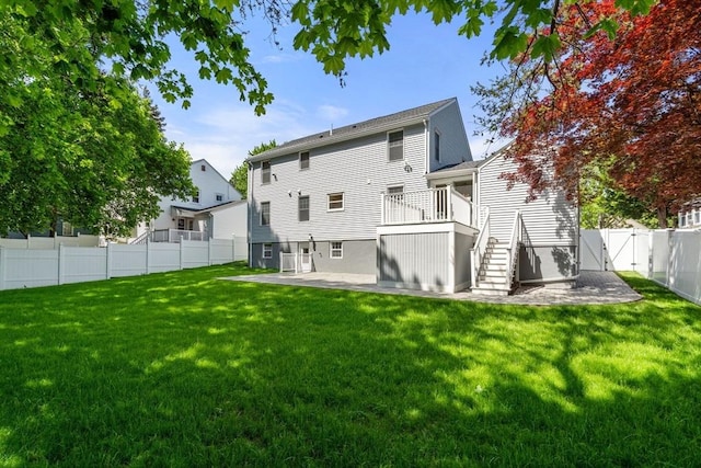 back of house featuring stairway, a patio, and a gate