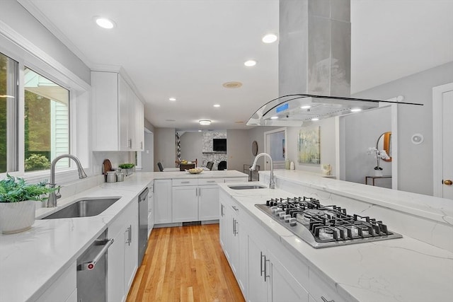 14 Preservation Way, Westford, MA 01886 - kitchen with island range hood, a sink, stainless steel gas cooktop, recessed lighting, and light stone countertops