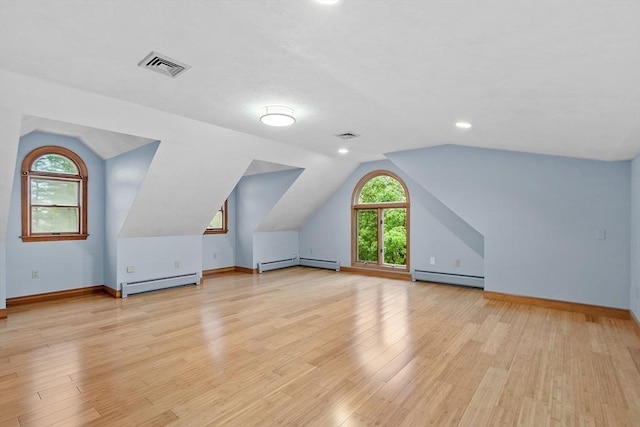 14 Preservation Way, Westford, MA 01886 - additional living space featuring a baseboard radiator, vaulted ceiling, light wood-style flooring, and recessed lighting
