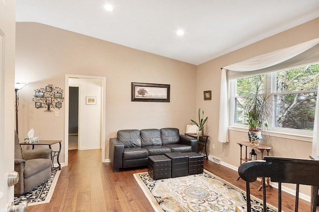 425 Main St Unit 8B, Hudson, MA 01749 - living area with vaulted ceiling, wood finished floors, baseboards, and recessed lighting