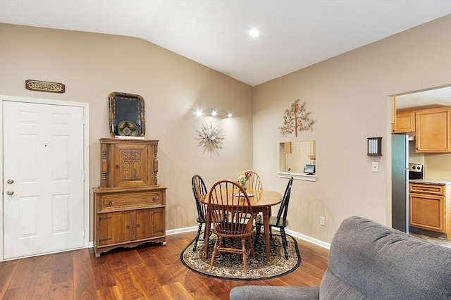 425 Main St Unit 8B, Hudson, MA 01749 - dining space with vaulted ceiling, dark wood-type flooring, and baseboards