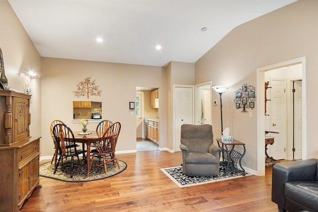 425 Main St Unit 8B, Hudson, MA 01749 - living room with light wood-style floors, lofted ceiling, baseboards, and recessed lighting