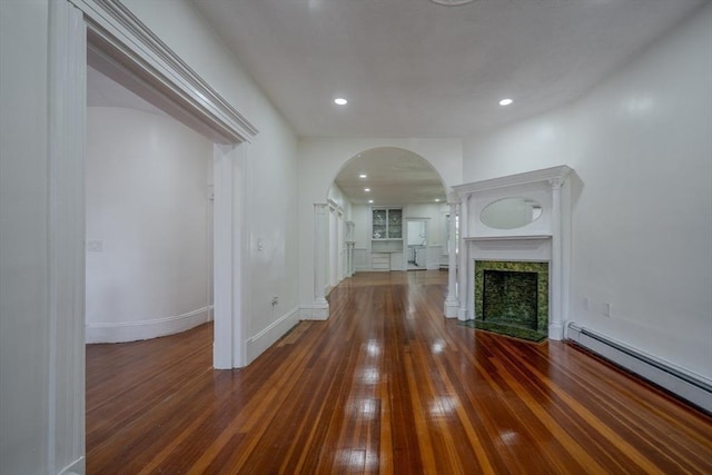 36-38 Elm Hill Park, Boston, MA 02121 - unfurnished living room with arched walkways, a baseboard radiator, hardwood / wood-style floors, recessed lighting, and baseboards