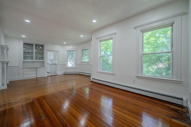 36-38 Elm Hill Park, Boston, MA 02121 - unfurnished living room featuring a baseboard heating unit, hardwood / wood-style flooring, and recessed lighting