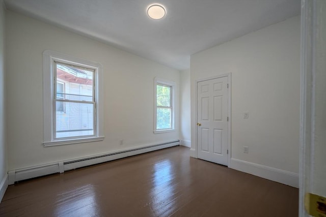 36-38 Elm Hill Park, Boston, MA 02121 - unfurnished room featuring a baseboard heating unit, wood finished floors, and baseboards