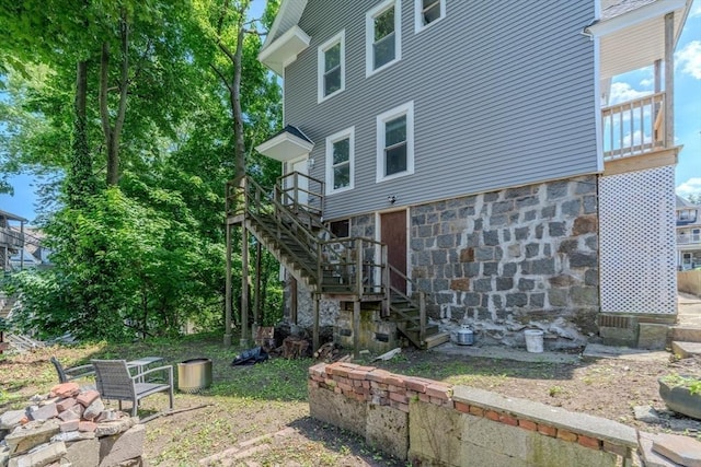 36-38 Elm Hill Park, Boston, MA 02121 - rear view of property featuring stairway and stone siding