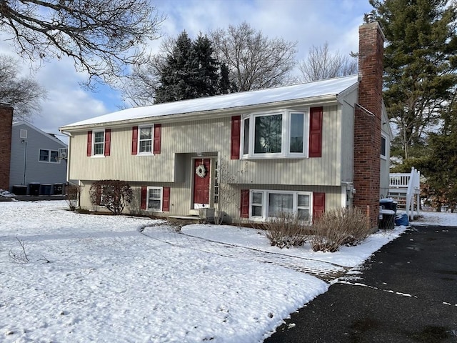 split foyer home featuring central air condition unit