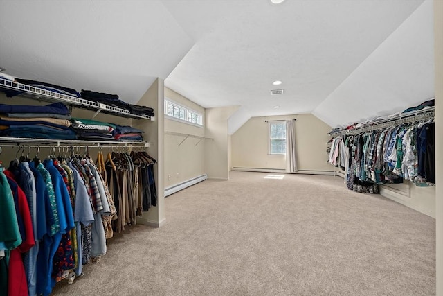 148 Old Schoolhouse Ln, Hanover, MA 02339 - walk in closet featuring baseboard heating, vaulted ceiling, and carpet