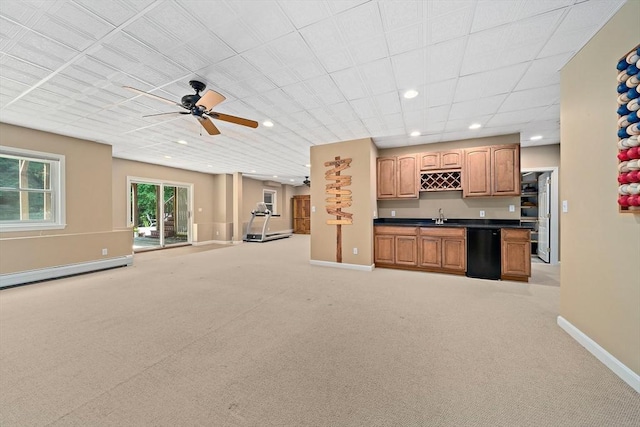148 Old Schoolhouse Ln, Hanover, MA 02339 - kitchen with black dishwasher, dark countertops, open floor plan, light carpet, and a ceiling fan