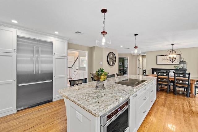 148 Old Schoolhouse Ln, Hanover, MA 02339 - kitchen featuring built in fridge, black electric cooktop, white cabinets, light wood-type flooring, and recessed lighting