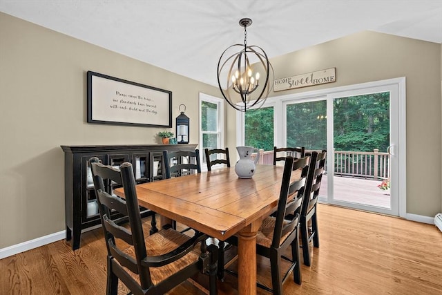 148 Old Schoolhouse Ln, Hanover, MA 02339 - dining space with a chandelier and light wood finished floors