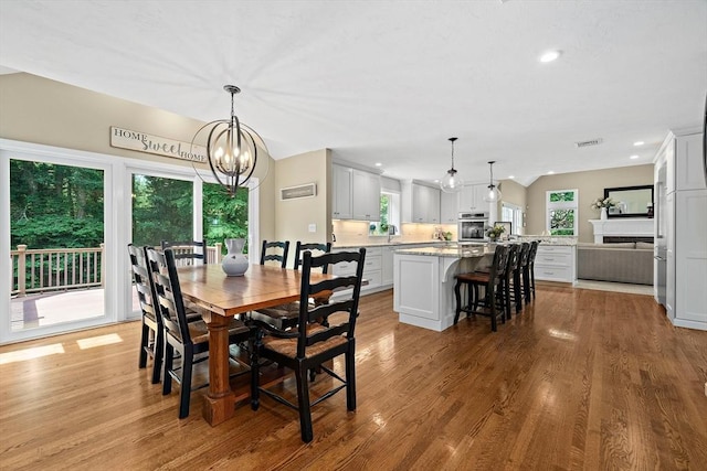 148 Old Schoolhouse Ln, Hanover, MA 02339 - dining space featuring a chandelier, wood finished floors, and recessed lighting