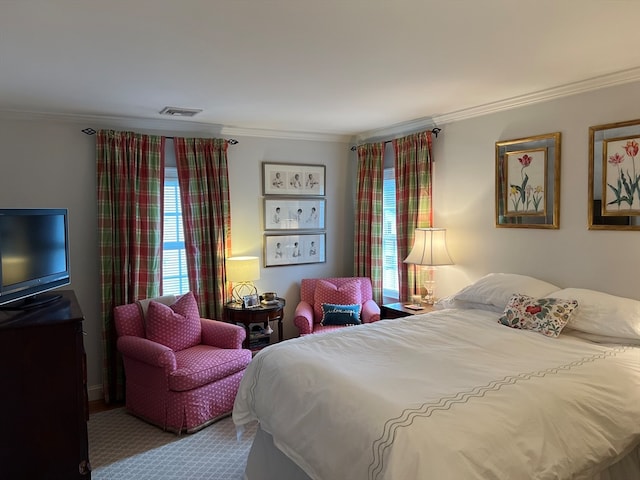 bedroom featuring light carpet, crown molding, and multiple windows