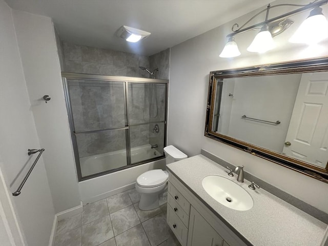 58 Oak St, Wellesley, MA 02482 - bathroom featuring enclosed tub / shower combo, vanity, toilet, and tile patterned floors