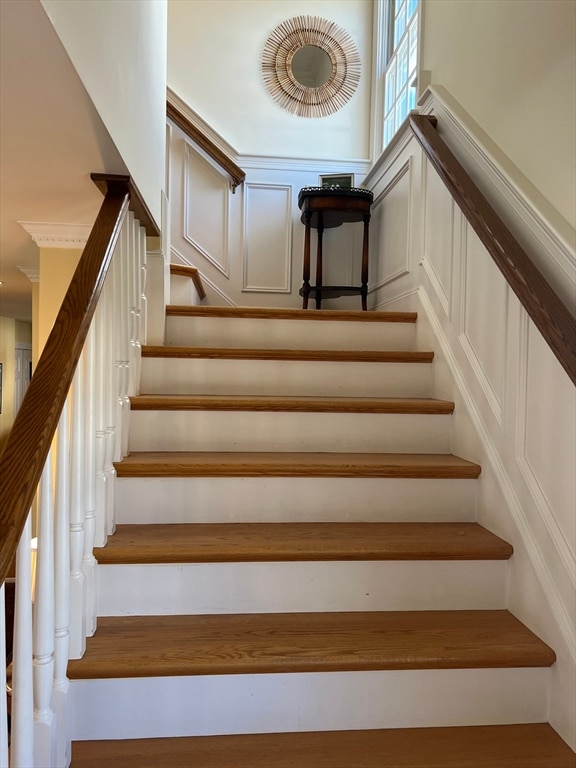 stairway with hardwood / wood-style floors