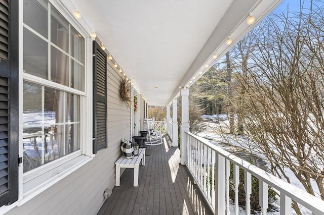 view of snow covered deck