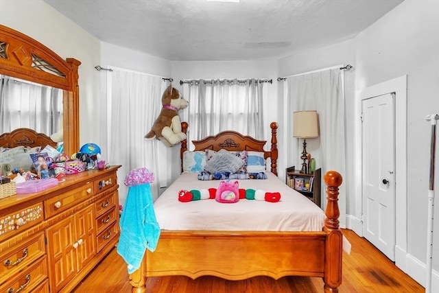 bedroom featuring light wood-type flooring