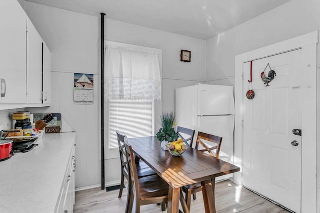 dining area with light wood-type flooring