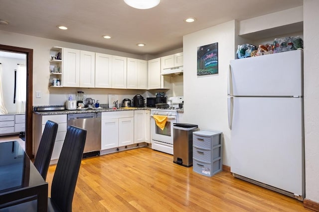 kitchen with light hardwood / wood-style floors, white cabinetry, white appliances, and sink