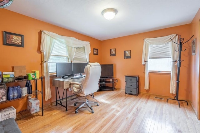 office area featuring wood finished floors and plenty of natural light