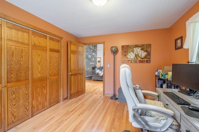 office with light wood-style flooring