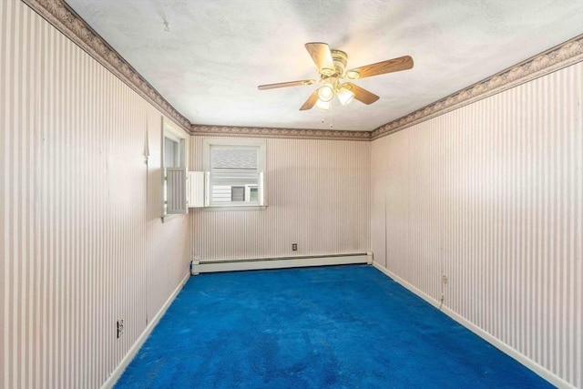 spare room featuring a baseboard heating unit, a textured ceiling, carpet flooring, baseboards, and ceiling fan