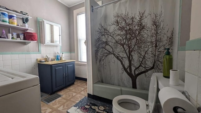 full bathroom featuring shower / bath combo, tile walls, vanity, ornamental molding, and toilet