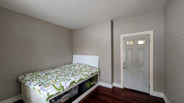 bedroom featuring dark hardwood / wood-style flooring