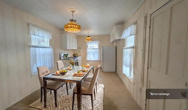 tiled dining room with tile walls