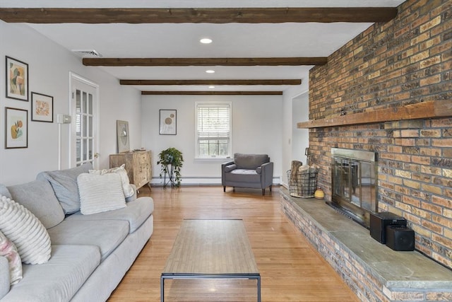 27 N Brigham Hill Rd, Grafton, MA 01536 - living area featuring wood finished floors, a baseboard radiator, a fireplace, beam ceiling, and recessed lighting
