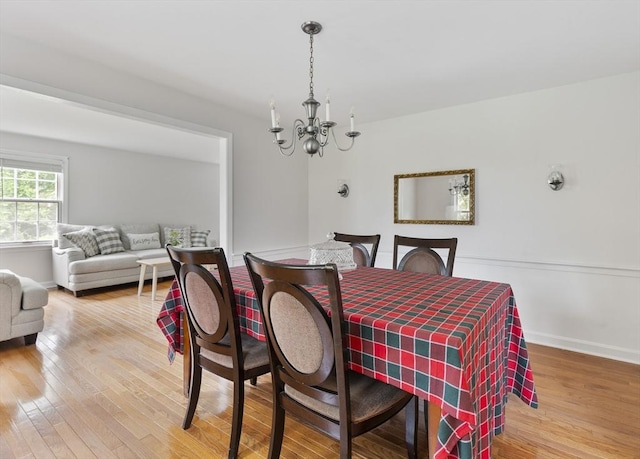 27 N Brigham Hill Rd, Grafton, MA 01536 - dining area with a chandelier and light wood-type flooring