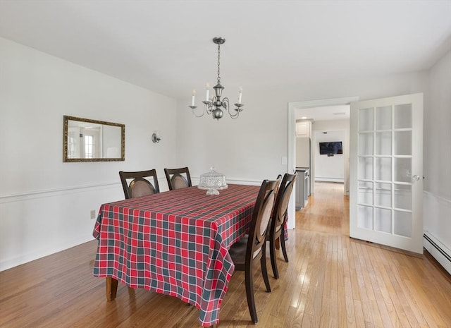 27 N Brigham Hill Rd, Grafton, MA 01536 - dining area with a chandelier, light wood-style floors, and baseboard heating