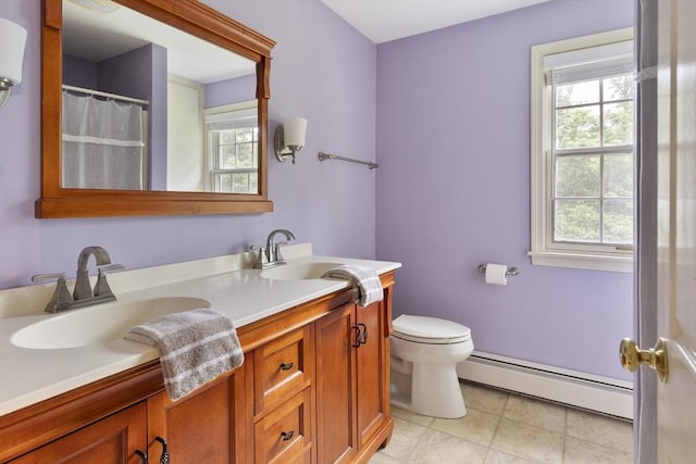 27 N Brigham Hill Rd, Grafton, MA 01536 - bathroom with a baseboard heating unit, double vanity, plenty of natural light, and tile patterned flooring