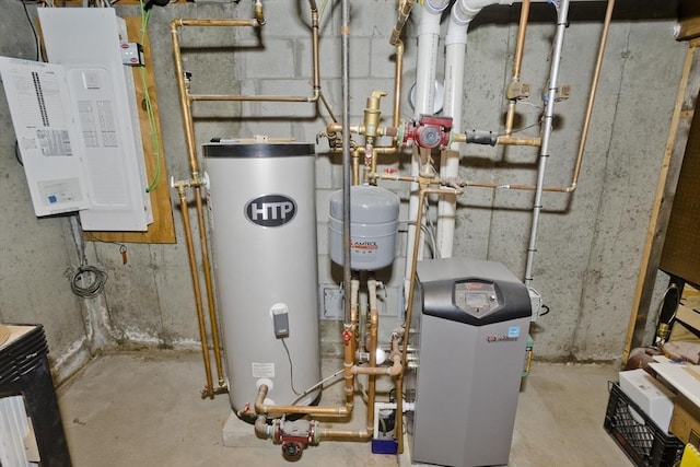 utility room with a heating unit, gas water heater, and electric panel