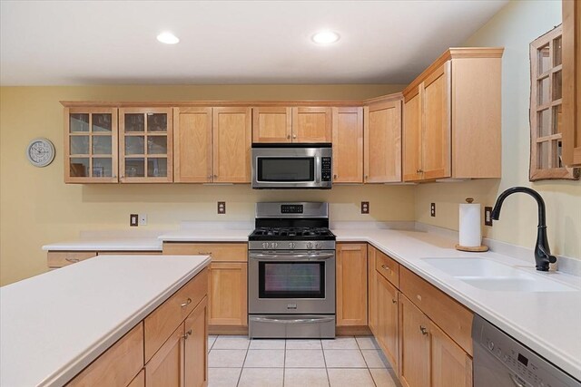 3 Angell Brook Dr Unit 3, West Boylston, MA 01583 - kitchen with appliances with stainless steel finishes, light countertops, glass insert cabinets, light tile patterned floors, and light brown cabinets