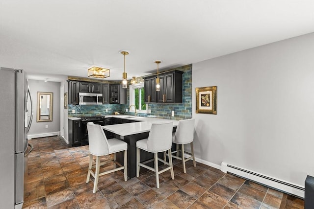 dining area featuring baseboard heating, baseboards, and dark stone finish flooring