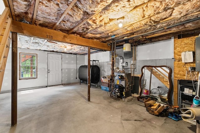 basement featuring oil tank and a heating unit