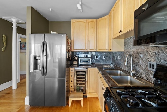 kitchen with stainless steel refrigerator with ice dispenser, light brown cabinetry, tasteful backsplash, range, and wine cooler