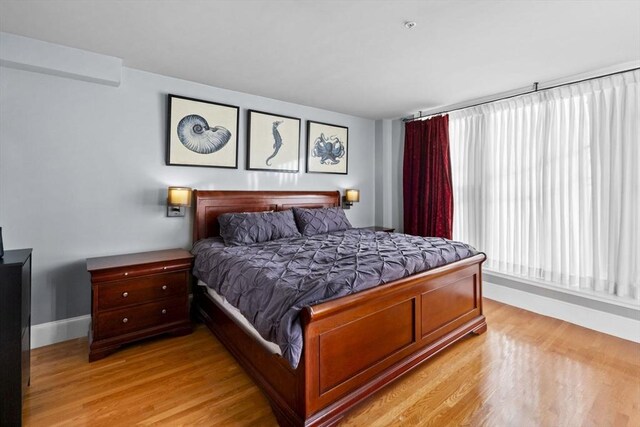 bedroom with light wood-type flooring