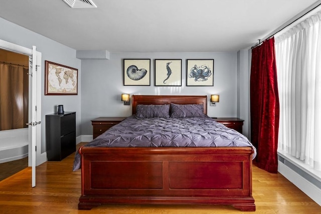 bedroom with light hardwood / wood-style floors