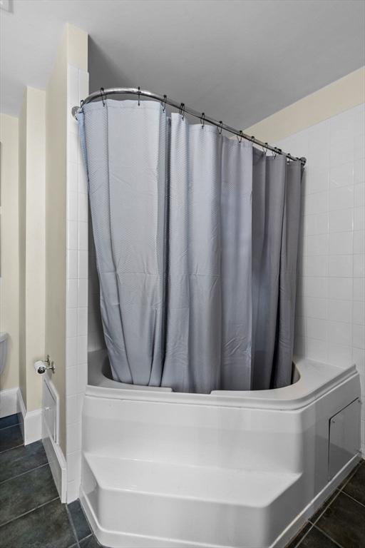 bathroom featuring tile patterned floors and a shower with shower curtain