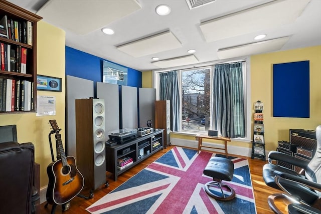 home theater room featuring dark wood-type flooring